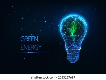 Abstract green energy concept with glowing low polygonal lightbulb and green sprout on dark blue