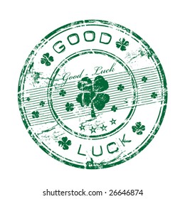 Abstract green grunge rubber office stamp with clovers and the text good luck written inside the stamp