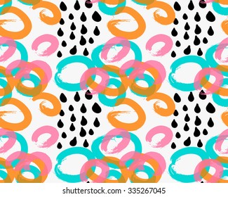 Abstract green orange and pink marker circles.Hand drawn with paint brush seamless background.Modern hipster style design.