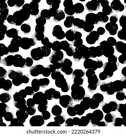 Abstract grunge background with with randomly placed black spots. black and white illustration.
