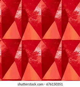 Abstract grunge scratched diamond pattern resembling folded metal foil. Red, orange, white and pink metal shiny background