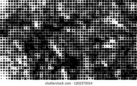 Abstract grunge texture of black squares on a white background