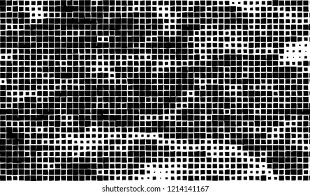 Abstract grunge texture of black squares on a white background