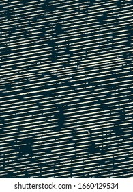 Abstract grunge vector background. Monochrome composition of irregular striped graphic elements.