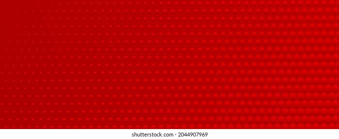 Abstract halftone background made of small hexagonal dots of different sizes in red colors