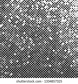 Abstract halftone background texture of black dots.