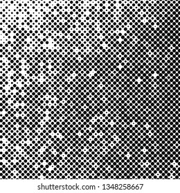 Abstract halftone background texture of black dots.