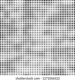 Abstract halftone. Black dots on white background. Chaotic monochrome texture