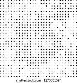 Abstract halftone. Black dots on white background. Chaotic monochrome texture