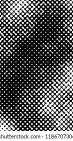 Abstract halftone pattern formed by black and white circles of different size.Vector illustration of a dotted background.