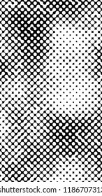 Abstract halftone pattern formed by black and white circles of different size.Vector illustration of a dotted background.
