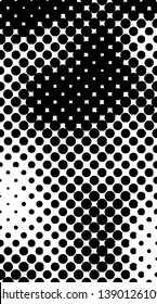 Abstract halftone pattern formed by black and white circles of different size.Vector illustration of a dotted background.