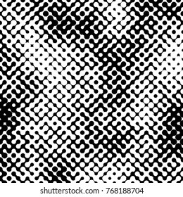 Abstract halftone pattern formed by black and white circles of different size.Vector illustration of a dotted background