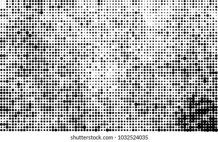 An abstract halftone texture. Black and white pattern of dots on a white background. Texture for printing on business cards, badges, posters, labels