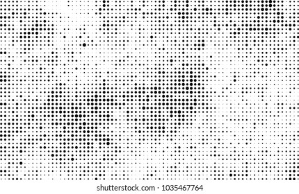 An abstract halftone texture. Black and white pattern of dots on a white background. Texture for printing on business cards, badges, posters, labels