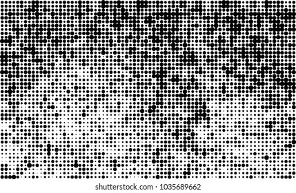 An abstract halftone texture. Black and white pattern of dots on a white background. Texture for printing on business cards, badges, posters, labels