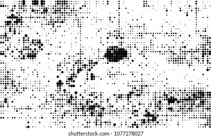 An abstract halftone texture. A chaotic pattern of black dots on a white background