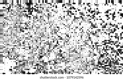 An abstract halftone texture. A chaotic pattern of black dots on a white background
