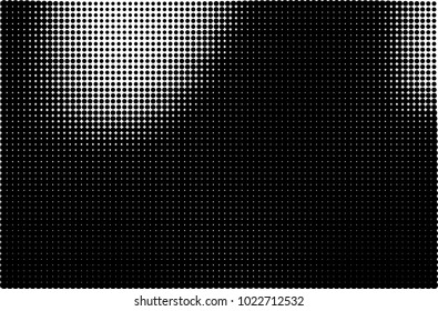 An abstract halftone texture. A pattern of black dots on a white background