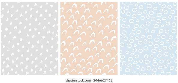 Abstract Hand Drawn Childish Vector Patterns. White Spots, Circles and Arcs on a Gray, Beige and Blue Background.Modern Geometric Seamless Pattern. Irregular Freehand Print. RGB.Abstract Doodle Print.