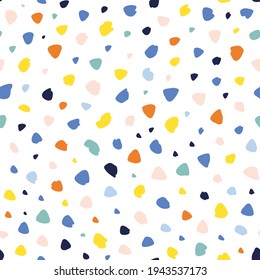 Abstract hand drawn dots and irregular shapes randomly placed seamless repeat pattern. Multicolor confetti like all over print with white background.