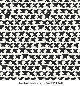 Abstract hand drawn monochrome background with rows of repeating X marks. Grungy irregular texture perfect for prints, postcards and wrapping paper. Vector seamless pattern.
