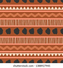 Abstract hand drawn seamless repeating pattern in black, brown, orange and cream. African mudcloth fabric, wallpaper, stationery, branding identity and packaging design.
