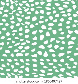 Abstract hand drawn spots seamless pattern white blotch tracery on green background irregular rhythm and size vector illustration
