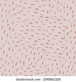 Abstract hand drawn striped seamless pattern. Chaotic short brushstrokes. Pastel beige colors. Ideal for textile, fabrics, wallpaper, background and paper.