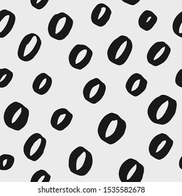 Abstract hand drawn vector seamless pattern. Black and white circle background