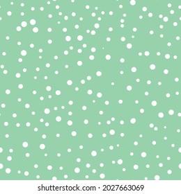 Abstract hand drown polka dots background. Green dotted seamless pattern with white circles. Template design for invitation, poster, card, flyer, textile, fabric.