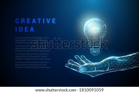 Abstract hand holding light bulb. Low poly style design. Blue geometric background. Wireframe light connection structure. Modern 3d graphic concept. Isolated vector illustration.