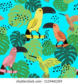 Abstract hand painted seamless animal background.Isolated birds with palm leaves. Toucans and humming birds pattern on blue. Vector illustration.