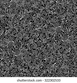 Abstract hand-drawn leafy doodle seamless pattern in black and white.