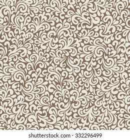 Abstract hand-drawn leafy doodle seamless pattern in vintage brown colors.