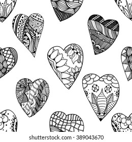 Abstract hand-drawn seamless pattern. Doodle vector background with heart, flower, leaves, wing, feather.