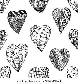 Abstract hand-drawn seamless pattern. Doodle vector background with heart, flower, leaves, wing, feather.