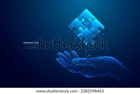 Abstract hand-holding jigsaw puzzle hologram in futuristic light blue style. Digital business solution concept. Low poly wireframe vector illustration on dark technology background. 