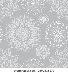 Abstract handmade snowflakes. Circles of dots.The pattern is handmade and seamless. Seamless pattern.