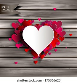 Abstract heart on wooden background