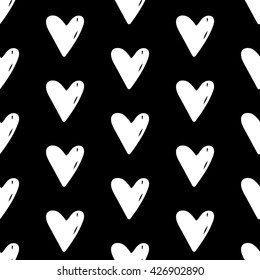 Abstract heart pattern with hand drawn hearts. Cute vector black and white heart pattern. Seamless monochrome doodle heart pattern for fabric, wallpapers, wrapping paper, cards and web backgrounds.