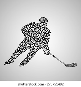 Abstract hockey player with a stick. Vector illustration. Eps 10