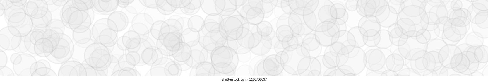 Abstract horizontal banner or background of randomly distributed translucent circles with outlines in white colors.