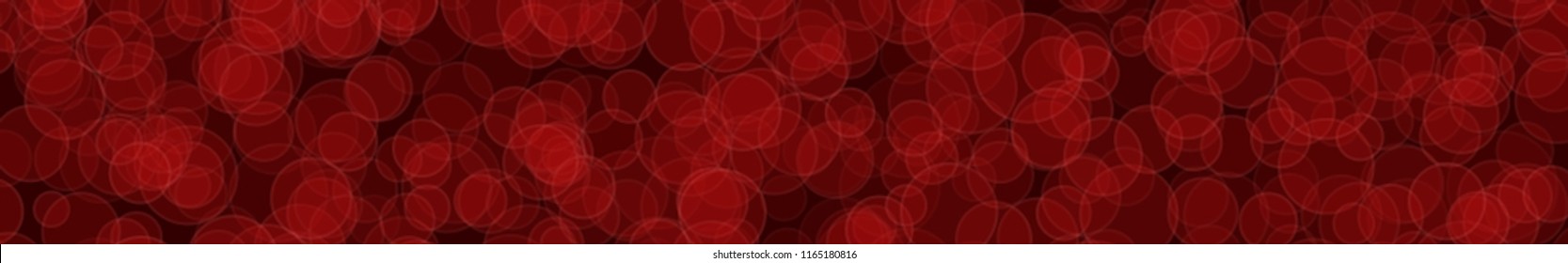 Abstract horizontal banner or background of randomly distributed translucent circles with outlines in red colors.