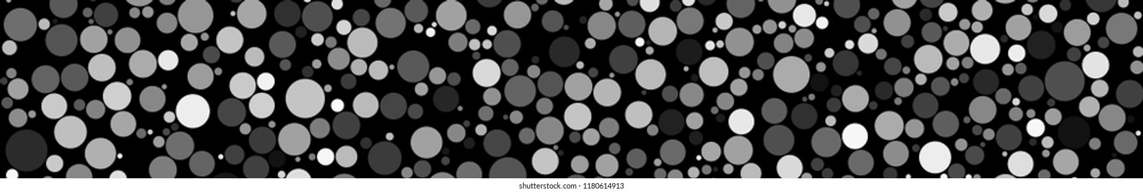 Abstract horizontal banner of circles of different sizes in shades of gray colors on black background