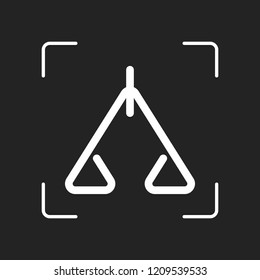 abstract icon or logo of scale. White object in camera autofocus on dark background