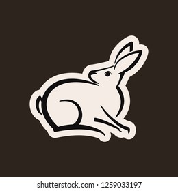 Abstract icon of a rabbit. Black and white simple logo. Vector illustration. Browm background.