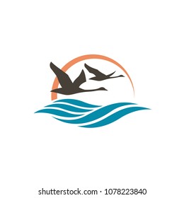 abstract icon with swans, sun and waves