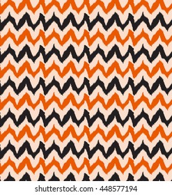 abstract Ikat  wave pattern background  zig zag orange and black.