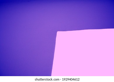Abstract illustration of purple and pink geometric corners.